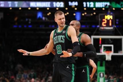 Nov 22, 2023; Boston, Massachusetts, USA; Boston Celtics center Kristaps Porzingis (8) reacts after getting a technical foul during the second half against the Milwaukee Bucks at TD Garden. Mandatory Credit: Paul Rutherford-USA TODAY Sports