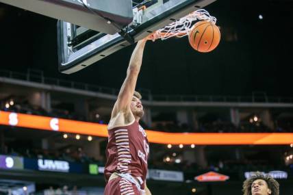 Nov 23, 2023; Kansas City, Missouri, USA; Boston College Eagles forward Quinten Post (12) dunks during the first half against the Loyola (Il) Ramblers at T-Mobile Center. Mandatory Credit: William Purnell-USA TODAY Sports