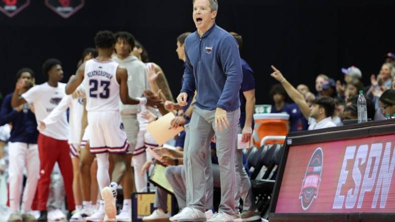 Nov 24, 2023; Kissimmee, FL, USA;  Florida Atlantic Owls head coach Dusty May calls to his team against the Texas A&M Aggies in the second half during the ESPN Events Invitational Semifinals at State Farm Field House. Mandatory Credit: Nathan Ray Seebeck-USA TODAY Sports