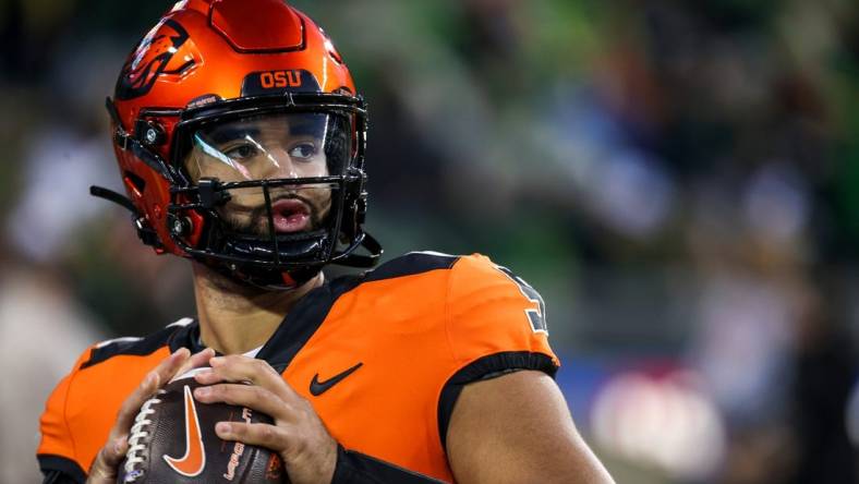 Oregon State Beavers quarterback DJ Uiagalelei warm ups before the annual rivalry game against Oregon on Friday, Nov. 24, 2023 at Autzen Stadium in Eugene, Ore.