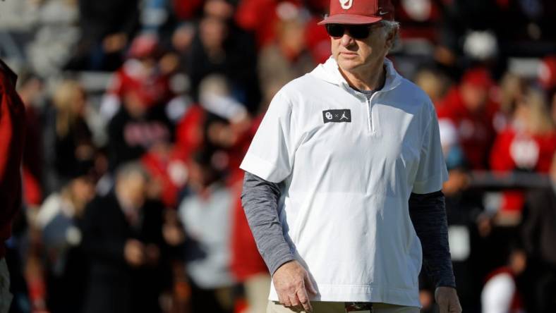 Oklahoma defensive coordinator Ted Roof watches the Sooners warm up before a college football game between the University of Oklahoma Sooners (OU) and the TCU Horned Frogs at Gaylord Family-Oklahoma Memorial Stadium in Norman, Okla., Friday, Nov. 24, 2023. Oklahoma won 69-45.