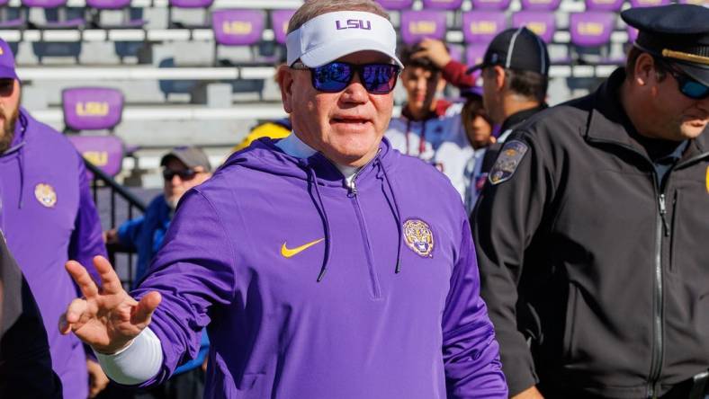 Nov 25, 2023; Baton Rouge, Louisiana, USA;  LSU Tigers head coach Brian Kelly waves to fans during warmups before the game against the Texas A&M Aggies at Tiger Stadium. Mandatory Credit: Stephen Lew-USA TODAY Sports