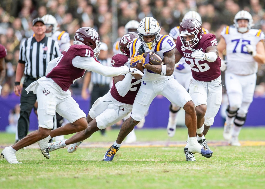 Malik Nabers 8 fights for extra yards as the LSU Tigers take on Texas A&M in Tiger Stadium in Baton Rouge, Louisiana, November 25, 2023.