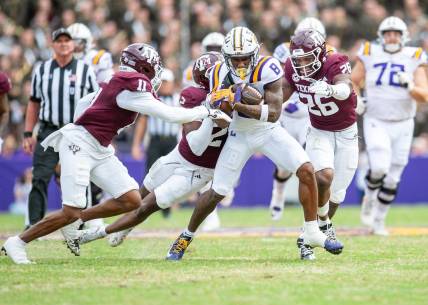 Malik Nabers 8 fights for extra yards as the LSU Tigers take on Texas A&M in Tiger Stadium in Baton Rouge, Louisiana, November 25, 2023.