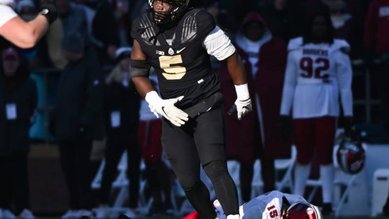 Nov 25, 2023; West Lafayette, Indiana, USA; Purdue Boilermakers linebacker Nic Scourton (5) reacts after bringing down Indiana Hoosiers quarterback Brendan Sorsby (15) during the second half at Ross-Ade Stadium. Mandatory Credit: Robert Goddin-USA TODAY Sports