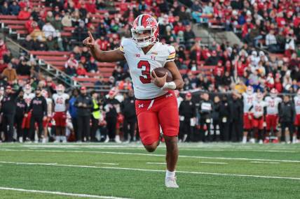 Nov 25, 2023; Piscataway, New Jersey, USA; Maryland Terrapins quarterback Taulia Tagovailoa (3) scores a rushing touchdown during the first half against the Rutgers Scarlet Knights at SHI Stadium. Mandatory Credit: Vincent Carchietta-USA TODAY Sports