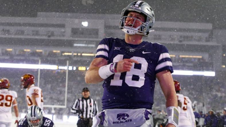 Nov 25, 2023; Manhattan, Kansas, USA; Kansas State Wildcats quarterback Will Howard (18) celebrates a touchdown in the third quarter against the Iowa State Cyclones at Bill Snyder Family Football Stadium. Mandatory Credit: Scott Sewell-USA TODAY Sports