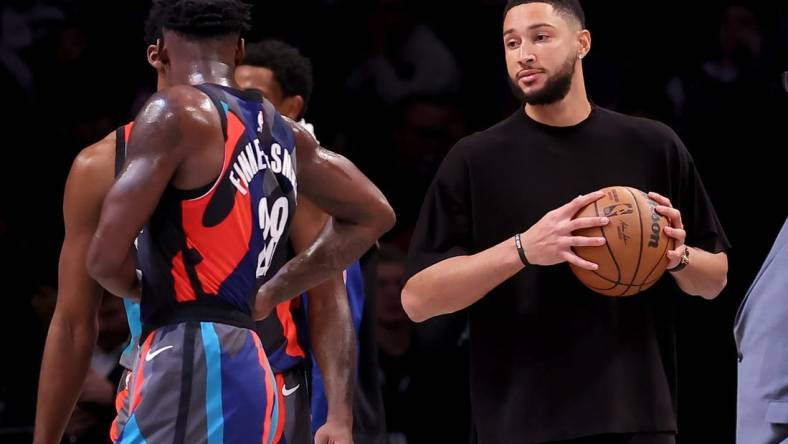 Nov 30, 2023; Brooklyn, New York, USA; Brooklyn Nets injured guard Ben Simmons (10) holds a basketball on the court during a time out during the third quarter against the Charlotte Hornets at Barclays Center. Mandatory Credit: Brad Penner-USA TODAY Sports