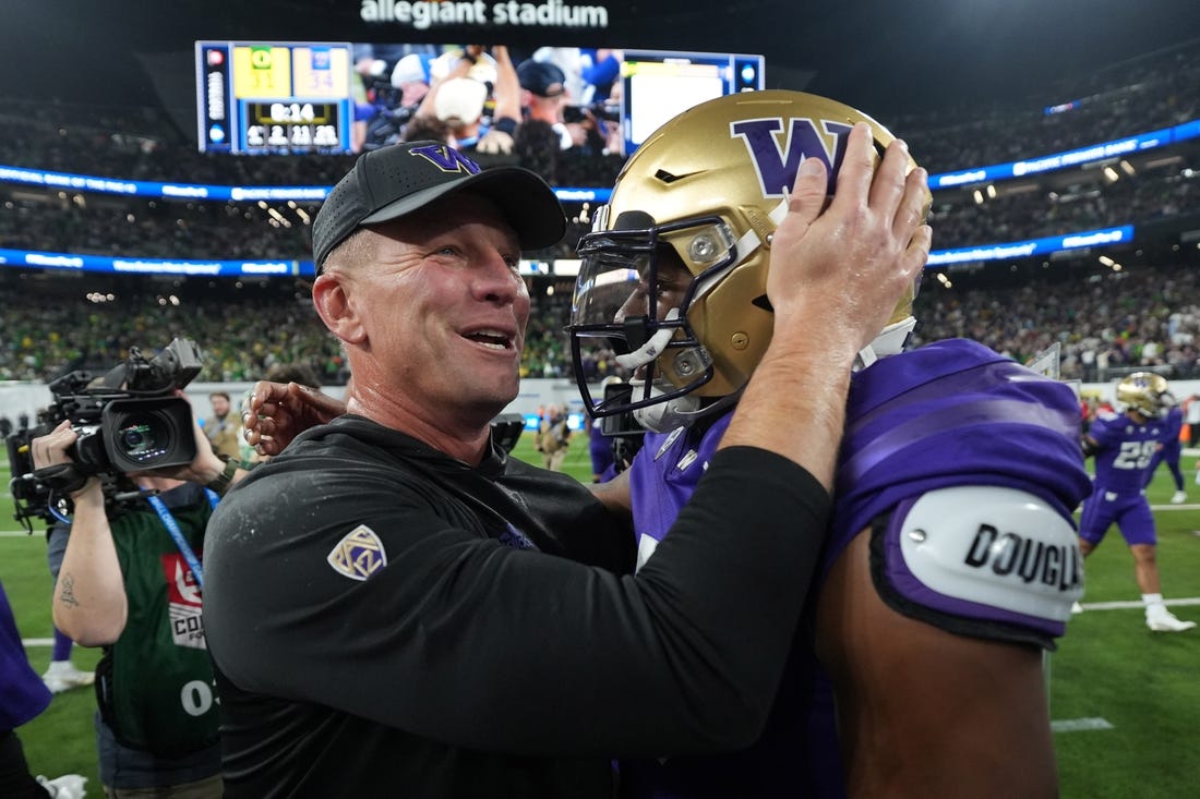 Dec 1, 2023; Las Vegas, NV, USA; Washington Huskies head coach Kalen DeBoer and quarterback Michael Penix Jr. (9) celebrate after the Pac-12 Championship game against the Oregon Ducks Allegiant Stadium. Mandatory Credit: Kirby Lee-USA TODAY Sports