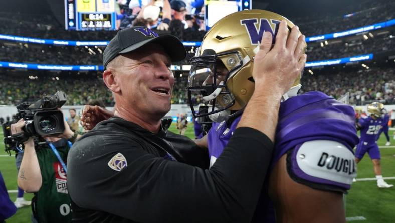 Dec 1, 2023; Las Vegas, NV, USA; Washington Huskies head coach Kalen DeBoer and quarterback Michael Penix Jr. (9) celebrate after the Pac-12 Championship game against the Oregon Ducks Allegiant Stadium. Mandatory Credit: Kirby Lee-USA TODAY Sports