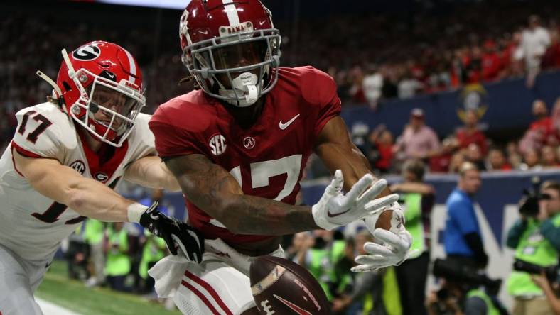 Dec 2, 2023; Atlanta, GA, USA; Alabama Crimson Tide wide receiver Isaiah Bond (17) attempts to make a catch against Georgia Bulldogs defensive back Dan Jackson (17) during the first half of the SEC Championship game at Mercedes-Benz Stadium. Mandatory Credit: Brett Davis-USA TODAY Sports