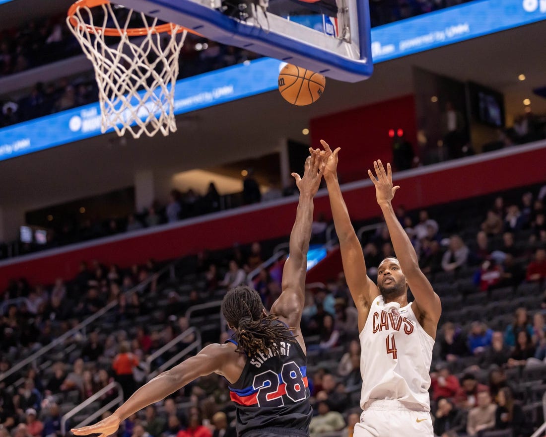 Dec 2, 2023; Detroit, Michigan, USA; Cleveland Cavaliers forward Evan Mobley (4) shoots the ball over Detroit Pistons center Isaiah Stewart (28) during the first half at Little Caesars Arena. Mandatory Credit: David Reginek-USA TODAY Sports