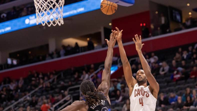 Dec 2, 2023; Detroit, Michigan, USA; Cleveland Cavaliers forward Evan Mobley (4) shoots the ball over Detroit Pistons center Isaiah Stewart (28) during the first half at Little Caesars Arena. Mandatory Credit: David Reginek-USA TODAY Sports