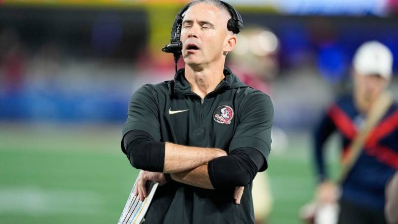 Dec 2, 2023; Charlotte, NC, USA; Florida State Seminoles head coach Mike Norvell reacts on the sidelines during the second quarter against the Louisville Cardinalsat Bank of America Stadium. Mandatory Credit: Jim Dedmon-USA TODAY Sports