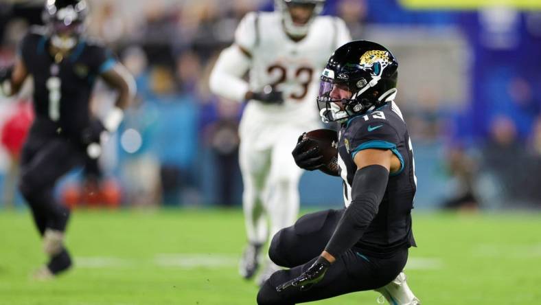 Dec 4, 2023; Jacksonville, Florida, USA;  Jacksonville Jaguars wide receiver Christian Kirk (13) catches a pass against the Cincinnati Bengals in the first quarter at EverBank Stadium. Mandatory Credit: Nathan Ray Seebeck-USA TODAY Sports