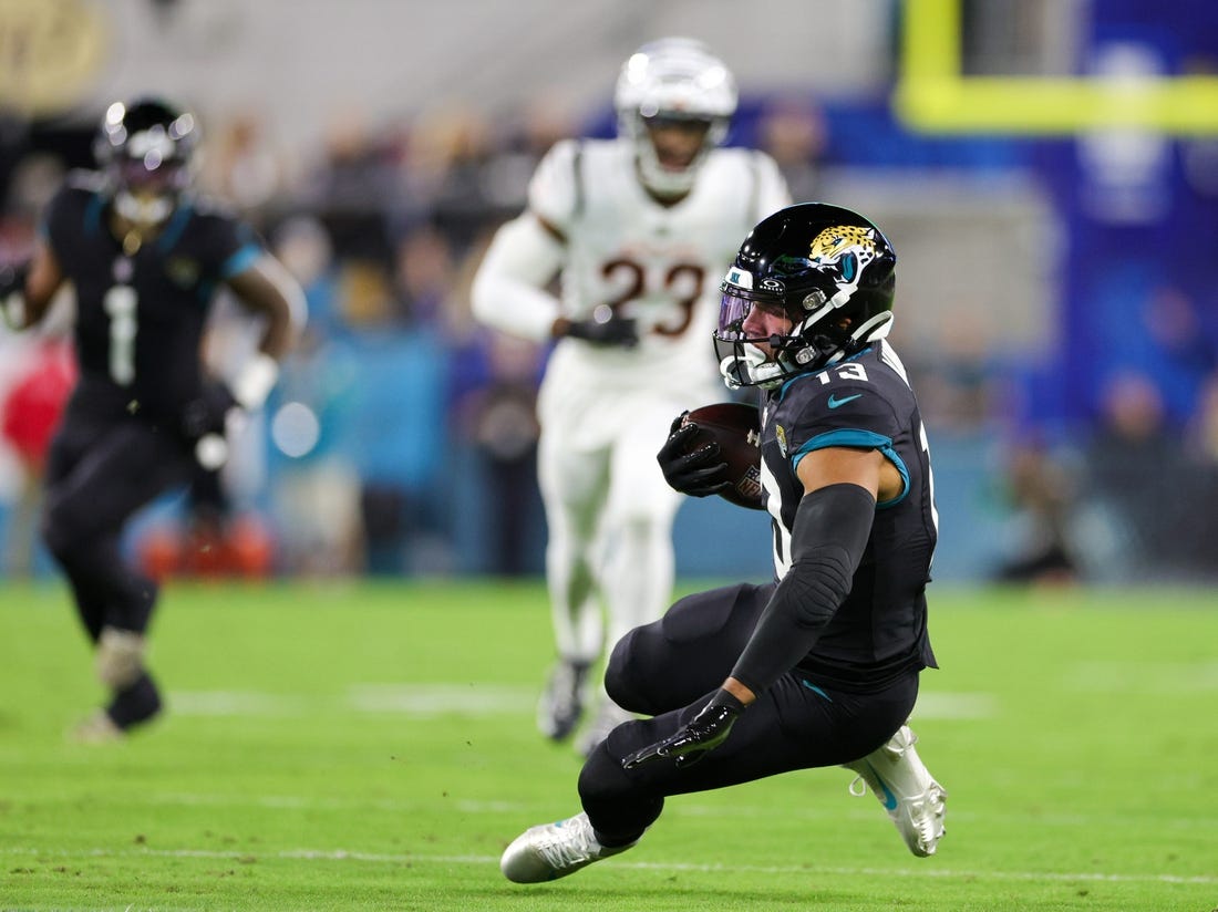 Dec 4, 2023; Jacksonville, Florida, USA;  Jacksonville Jaguars wide receiver Christian Kirk (13) catches a pass against the Cincinnati Bengals in the first quarter at EverBank Stadium. Mandatory Credit: Nathan Ray Seebeck-USA TODAY Sports