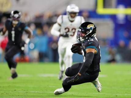 Dec 4, 2023; Jacksonville, Florida, USA;  Jacksonville Jaguars wide receiver Christian Kirk (13) catches a pass against the Cincinnati Bengals in the first quarter at EverBank Stadium. Mandatory Credit: Nathan Ray Seebeck-USA TODAY Sports