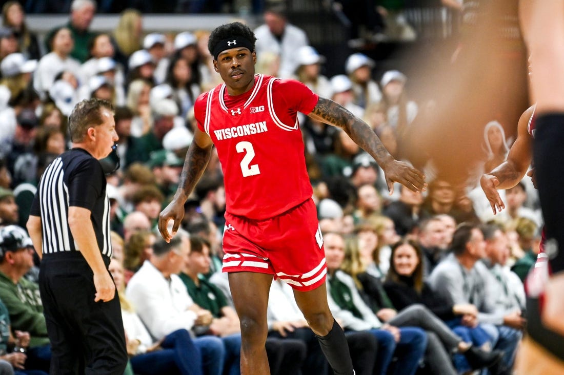 Wisconsin's AJ Storr celebrates after making a 3-pointer against Michigan State to end the first half on Tuesday, Dec. 5, 2023, at the Breslin Center in East Lansing.