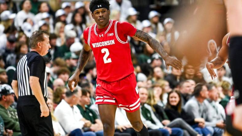 Wisconsin's AJ Storr celebrates after making a 3-pointer against Michigan State to end the first half on Tuesday, Dec. 5, 2023, at the Breslin Center in East Lansing.