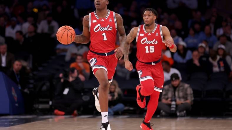 Dec 5, 2023; New York, New York, USA; Florida Atlantic Owls guard Johnell Davis (1) brings the ball up court against the Illinois Fighting Illini with guard Alijah Martin (15) during the second half at Madison Square Garden. Mandatory Credit: Brad Penner-USA TODAY Sports