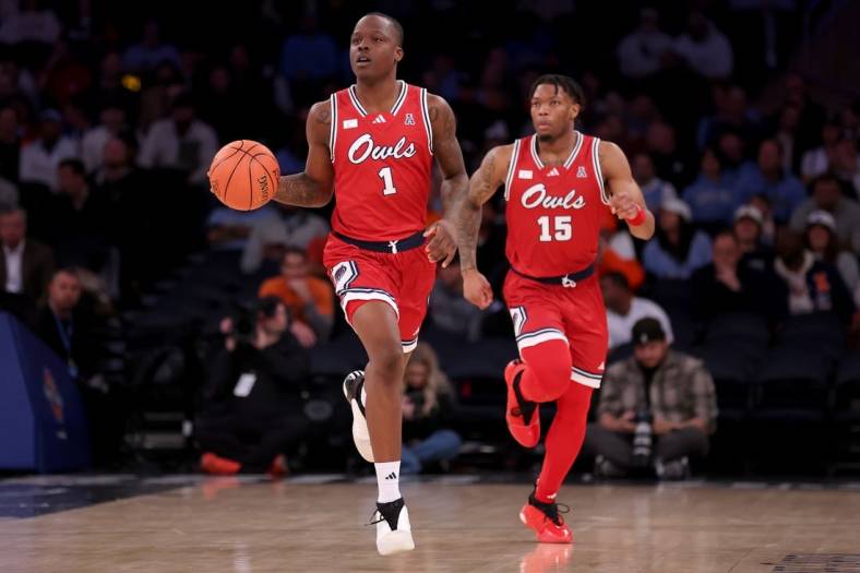 Dec 5, 2023; New York, New York, USA; Florida Atlantic Owls guard Johnell Davis (1) brings the ball up court against the Illinois Fighting Illini with guard Alijah Martin (15) during the second half at Madison Square Garden. Mandatory Credit: Brad Penner-USA TODAY Sports