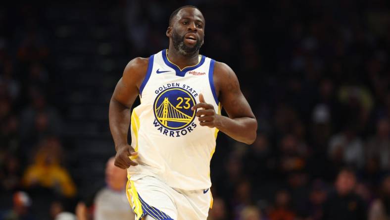 Dec 12, 2023; Phoenix, Arizona, USA; Golden State Warriors forward Draymond Green (23) against the Phoenix Suns at Footprint Center. Mandatory Credit: Mark J. Rebilas-USA TODAY Sports