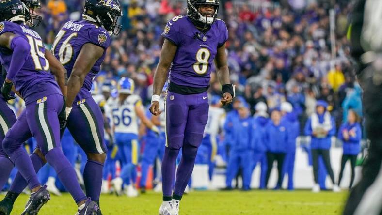 Dec 10, 2023; Baltimore, Maryland, USA;  Baltimore Ravens quarterback Lamar Jackson (8) celebrates after the team scores a touchdown against the Los Angeles Rams during the fourth quarter at M&T Bank Stadium. Mandatory Credit: Jessica Rapfogel-USA TODAY Sports