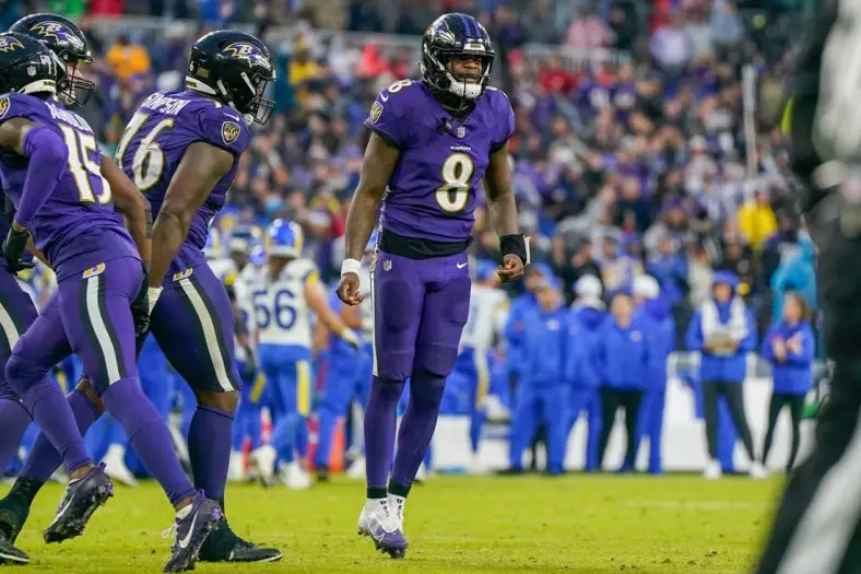 Dec 10, 2023; Baltimore, Maryland, USA;  Baltimore Ravens quarterback Lamar Jackson (8) celebrates after the team scores a touchdown against the Los Angeles Rams during the fourth quarter at M&T Bank Stadium. Mandatory Credit: Jessica Rapfogel-USA TODAY Sports