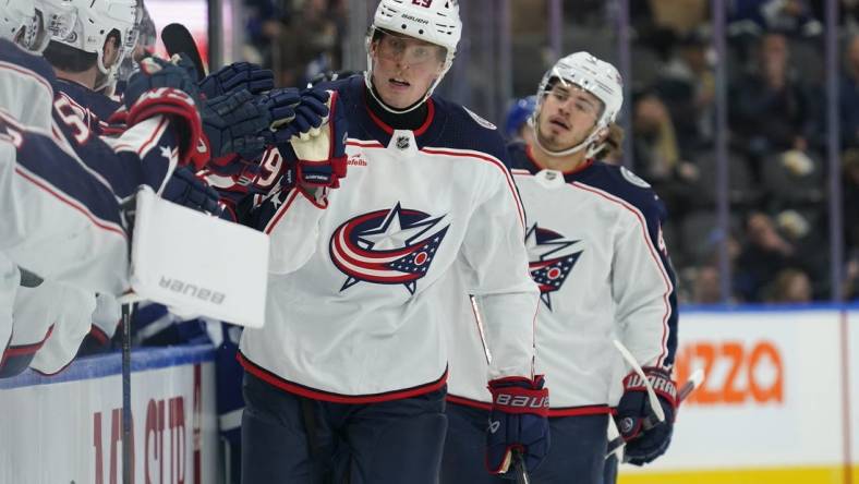 Dec 14, 2023; Toronto, Ontario, CAN; Columbus Blue Jackets forward Patrik Laine (29) gets congratulated after scoring against the Toronto Maple Leafs during the first period at Scotiabank Arena. Mandatory Credit: John E. Sokolowski-USA TODAY Sports