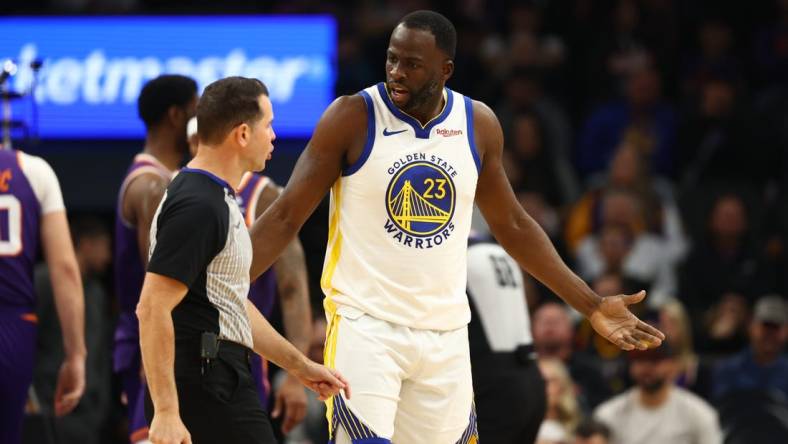 Dec 12, 2023; Phoenix, Arizona, USA; Golden State Warriors forward Draymond Green (23) reacts as he argues with an NBA referee against the Phoenix Suns at Footprint Center. Mandatory Credit: Mark J. Rebilas-USA TODAY Sports