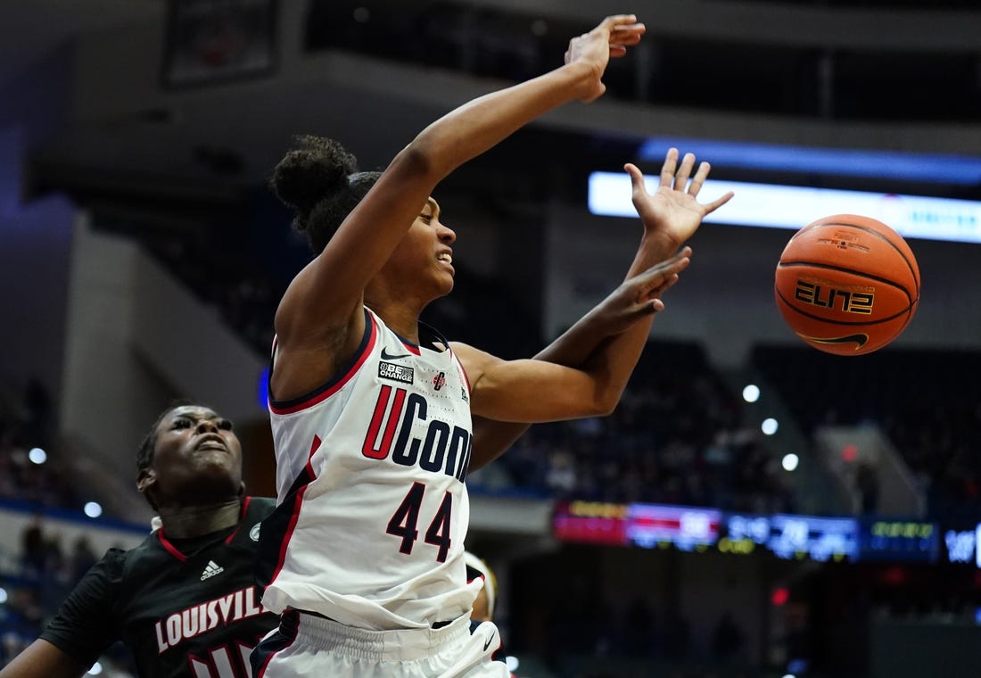 Dec 16, 2023; Hartford, Connecticut, USA; UConn Huskies guard Aubrey Griffin (44) is fouled by Louisville Cardinals forward Olivia Cochran (44) in the second half at XL Center. Mandatory Credit: David Butler II-USA TODAY Sports