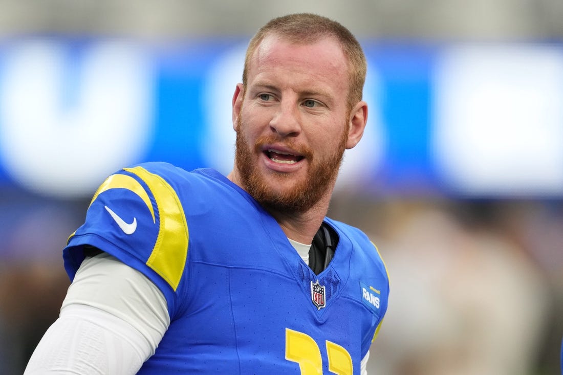 Dec 17, 2023; Inglewood, California, USA; Los Angeles Rams quarterback Carson Wentz (11) reacts during the first half against the Washington Commanders at SoFi Stadium. Mandatory Credit: Kirby Lee-USA TODAY Sports