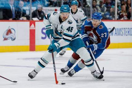 Dec 17, 2023; Denver, Colorado, USA; San Jose Sharks center Tomas Hertl (48) controls the puck ahead of Colorado Avalanche left wing Jonathan Drouin (27) in the third period at Ball Arena. Mandatory Credit: Isaiah J. Downing-USA TODAY Sports