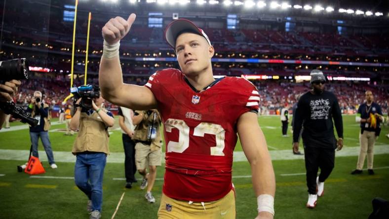 Dec 17, 2023; Glendale, Arizona, USA; San Francisco 49ers running back Christian McCaffrey (23) celebrates after beating the Arizona Cardinals at State Farm Stadium. Mandatory Credit: Mark J. Rebilas-USA TODAY Sports