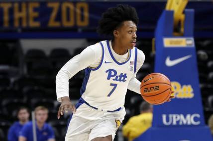 Dec 20, 2023; Pittsburgh, Pennsylvania, USA; Pittsburgh Panthers guard Carlton Carrington (7) dribbles up court on a fast break against the IPFW Mastodons during the first half at the Petersen Events Center. Mandatory Credit: Charles LeClaire-USA TODAY Sports