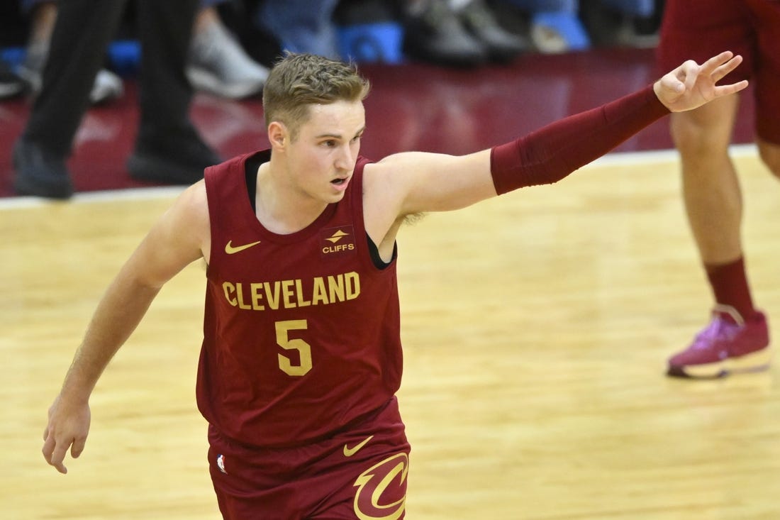 Dec 20, 2023; Cleveland, Ohio, USA; Cleveland Cavaliers guard Sam Merrill (5) celebrates his three-point basket in the fourth quarter against the Utah Jazz at Rocket Mortgage FieldHouse. Mandatory Credit: David Richard-USA TODAY Sports