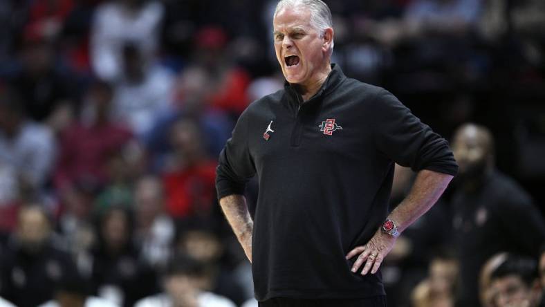 Dec 21, 2023; San Diego, California, USA; San Diego State Aztecs head coach Brian Dutcher yells out during the second half against the Stanford Cardinal at Viejas Arena. Mandatory Credit: Orlando Ramirez-USA TODAY Sports