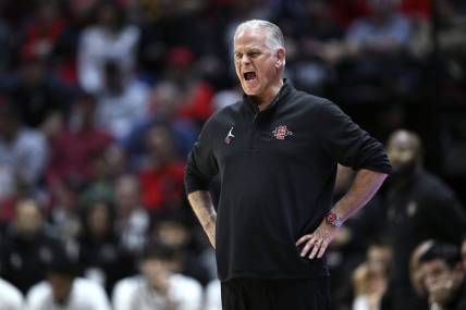 Dec 21, 2023; San Diego, California, USA; San Diego State Aztecs head coach Brian Dutcher yells out during the second half against the Stanford Cardinal at Viejas Arena. Mandatory Credit: Orlando Ramirez-USA TODAY Sports