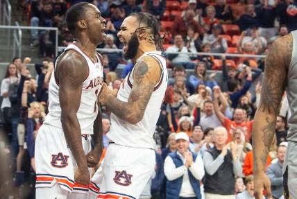 Auburn Tigers forward Jaylin Williams (2) and center Johni Broome (4) celebrate Williams alley-op dunk as Auburn Tigers take on Alabama State Hornets at Neville Arena in Auburn, Ala., on Friday, Dec. 22, 2023. Auburn Tigers defeated Alabama State Hornets 82-62.
