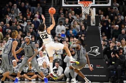 Dec 23, 2023; Providence, Rhode Island, USA; Providence Friars guard Devin Carter (22) shoots the ball against the Butler Bulldogs during overtime at Amica Mutual Pavilion. Mandatory Credit: Eric Canha-USA TODAY Sports