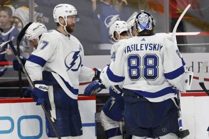 Dec 23, 2023; Washington, District of Columbia, USA; Tampa Bay Lightning goaltender Andrei Vasilevskiy (88) celebrates with Lightning defenseman Victor Hedman (77) after their game against the Washington Capitals at Capital One Arena. Mandatory Credit: Geoff Burke-USA TODAY Sports