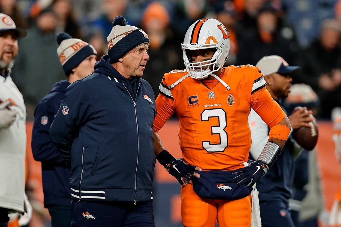 Dec 24, 2023; Denver, Colorado, USA; Denver Broncos head coach Sean Payton talks with quarterback Russell Wilson (3) before the game against the New England Patriots at Empower Field at Mile High. Mandatory Credit: Isaiah J. Downing-USA TODAY Sports