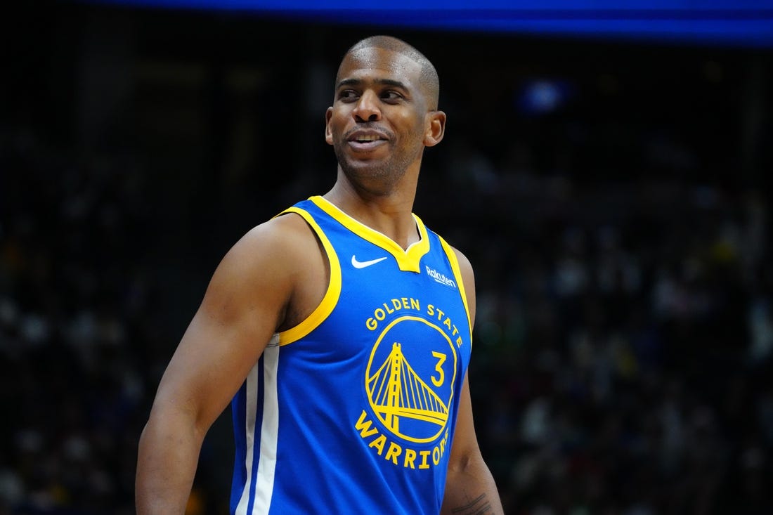 Dec 25, 2023; Denver, Colorado, USA; Golden State Warriors guard Chris Paul (3) reacts back to the Denver Nuggets bench in the third quarter at Ball Arena. Mandatory Credit: Ron Chenoy-USA TODAY Sports