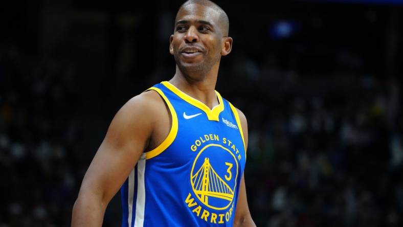 Dec 25, 2023; Denver, Colorado, USA; Golden State Warriors guard Chris Paul (3) reacts back to the Denver Nuggets bench in the third quarter at Ball Arena. Mandatory Credit: Ron Chenoy-USA TODAY Sports