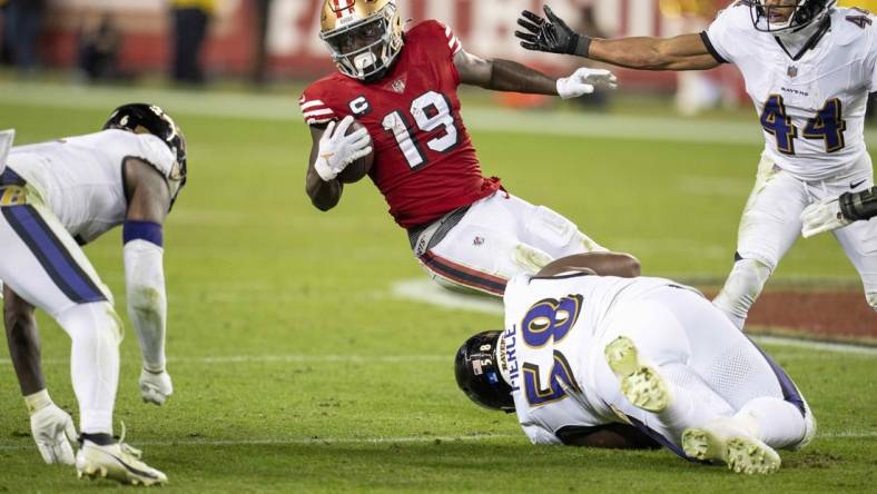 Dec 25, 2023; Santa Clara, California, USA; San Francisco 49ers wide receiver Deebo Samuel (19) is tackled by Baltimore Ravens defensive tackle Michael Pierce (58) during the fourth quarter at Levi's Stadium. Mandatory Credit: Neville E. Guard-USA TODAY Sports