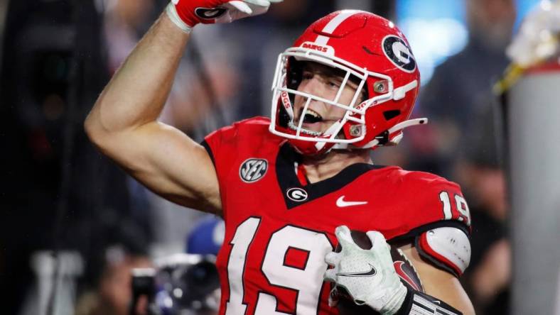 Georgia tight end Brock Bowers (19) celebrates after scoring a touchdown during the second half of a NCAA college football game against Ole Miss in Athens, Ga., on Saturday, Nov. 11, 2023. Georgia won 52-17.