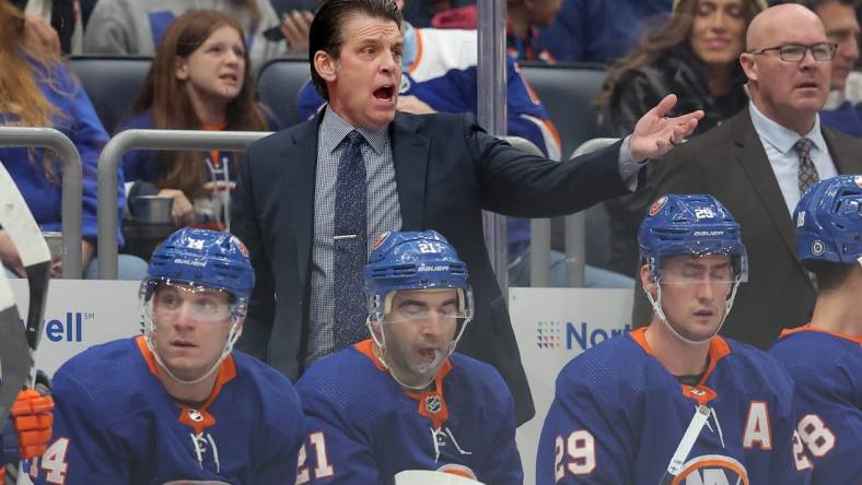 Dec 27, 2023; Elmont, New York, USA; New York Islanders head coach Lane Lambert reacts as he coaches against the Pittsburgh Penguins during the first period at UBS Arena. Mandatory Credit: Brad Penner-USA TODAY Sports