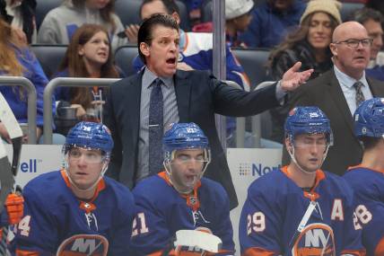 Dec 27, 2023; Elmont, New York, USA; New York Islanders head coach Lane Lambert reacts as he coaches against the Pittsburgh Penguins during the first period at UBS Arena. Mandatory Credit: Brad Penner-USA TODAY Sports