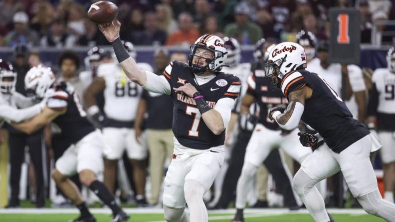 Dec 27, 2023; Houston, TX, USA; Oklahoma State Cowboys quarterback Alan Bowman (7) attempts a pass during the first quarter against the Texas A&M Aggies at NRG Stadium. Mandatory Credit: Troy Taormina-USA TODAY Sports