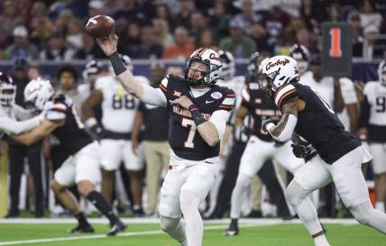 Dec 27, 2023; Houston, TX, USA; Oklahoma State Cowboys quarterback Alan Bowman (7) attempts a pass during the first quarter against the Texas A&M Aggies at NRG Stadium. Mandatory Credit: Troy Taormina-USA TODAY Sports
